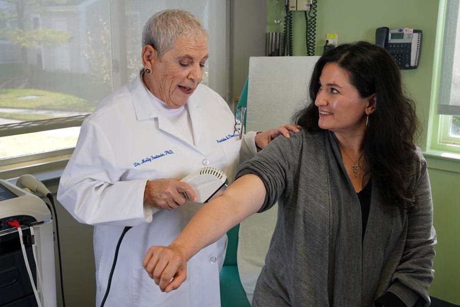 Dr. Molly Fantasia, PhD consulting with a patient at Innovative Medical Associates in Marlton, NJ